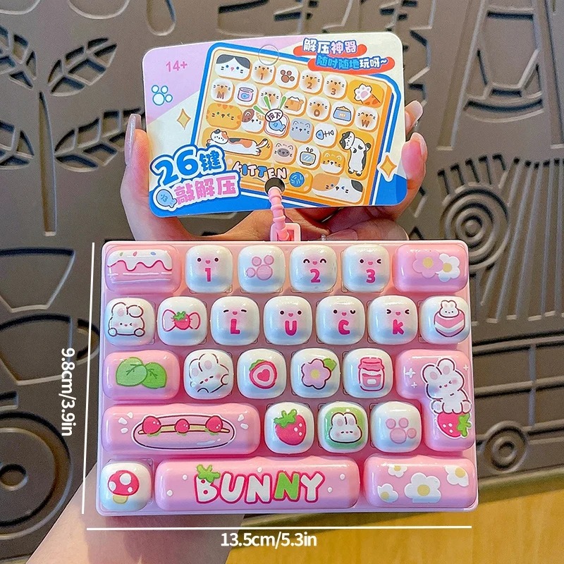 Party Favor Bag - 26グリッドの抗ストレスキーボードキーキャップクリッカー、キーチェーン付き、漫画風フィジェットバッグペンダント、キーボードチャーム、ストレス解消ギフト